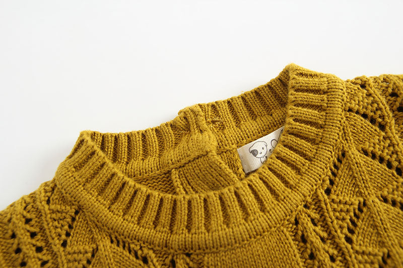 knitted baby romper with cables